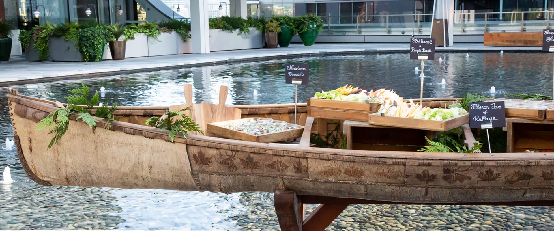A unique spread of food on a canoe at Parq Vancouver
