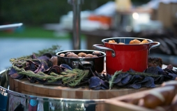 Fresh food in pots with greenery arrangement