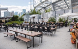 Rooftop park tables and chairs at Parq Vancouver